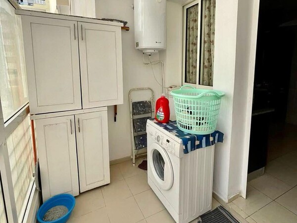 Comfortable Apartment Balcony and Laundry